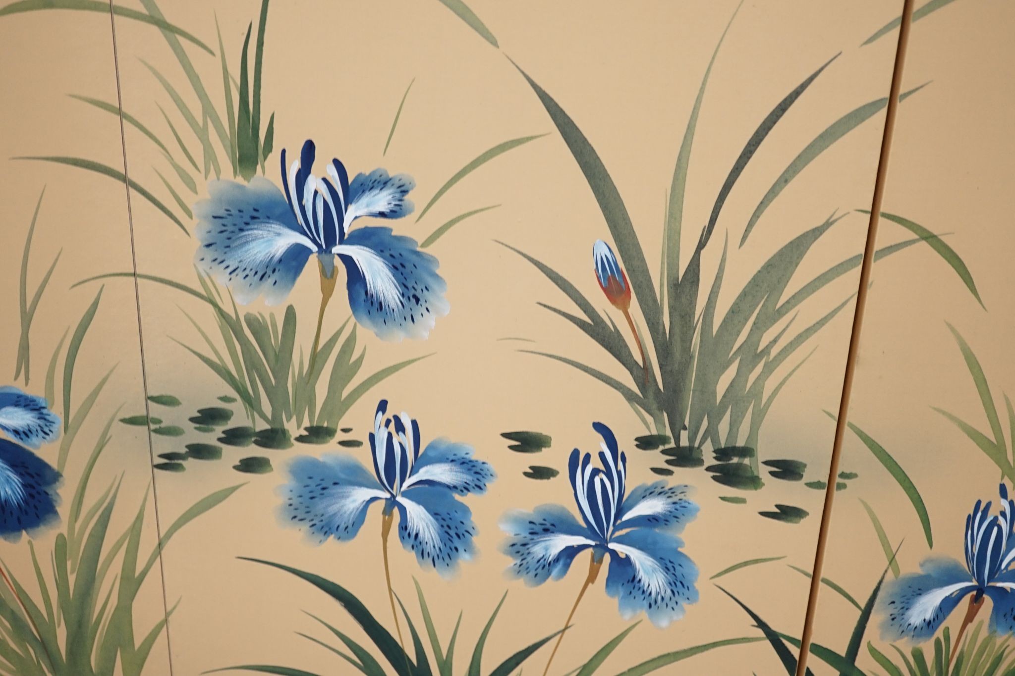 A Japanese painted silk four-fold screen, 152cm full width